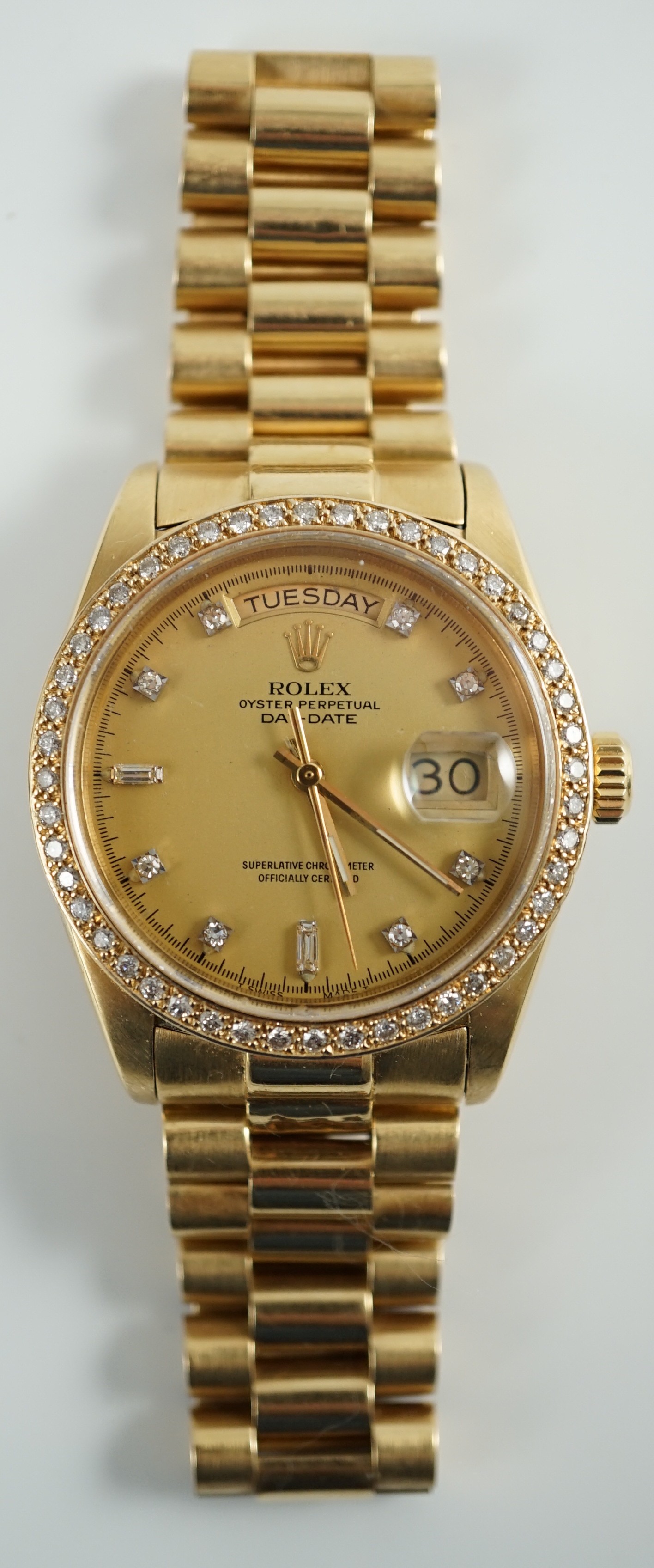 A gentleman's late 1970's 18ct gold Rolex Oyster Perpetual Day-Date wrist watch, with after market diamond set bezel and diamond set markers, on an 18ct gold Rolex bracelet with deployment clasp